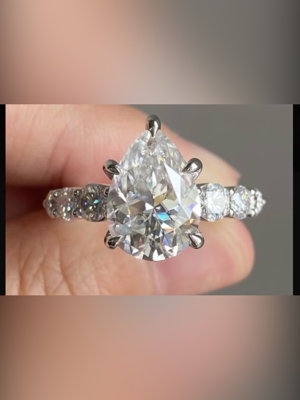 Pear-Shaped Clear Stone Engagement Ring with Pavé Band